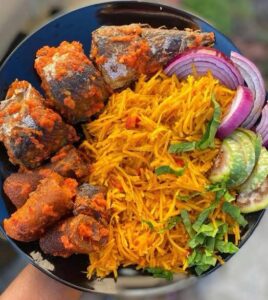 Abacha, a must-try Nigerian street food, also known as African Salad, made from dried cassava with a spicy dressing