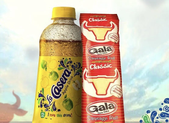 Gala and Lacasera, a classic must-try Nigerian street food combo of savory sausage rolls and refreshing apple drink